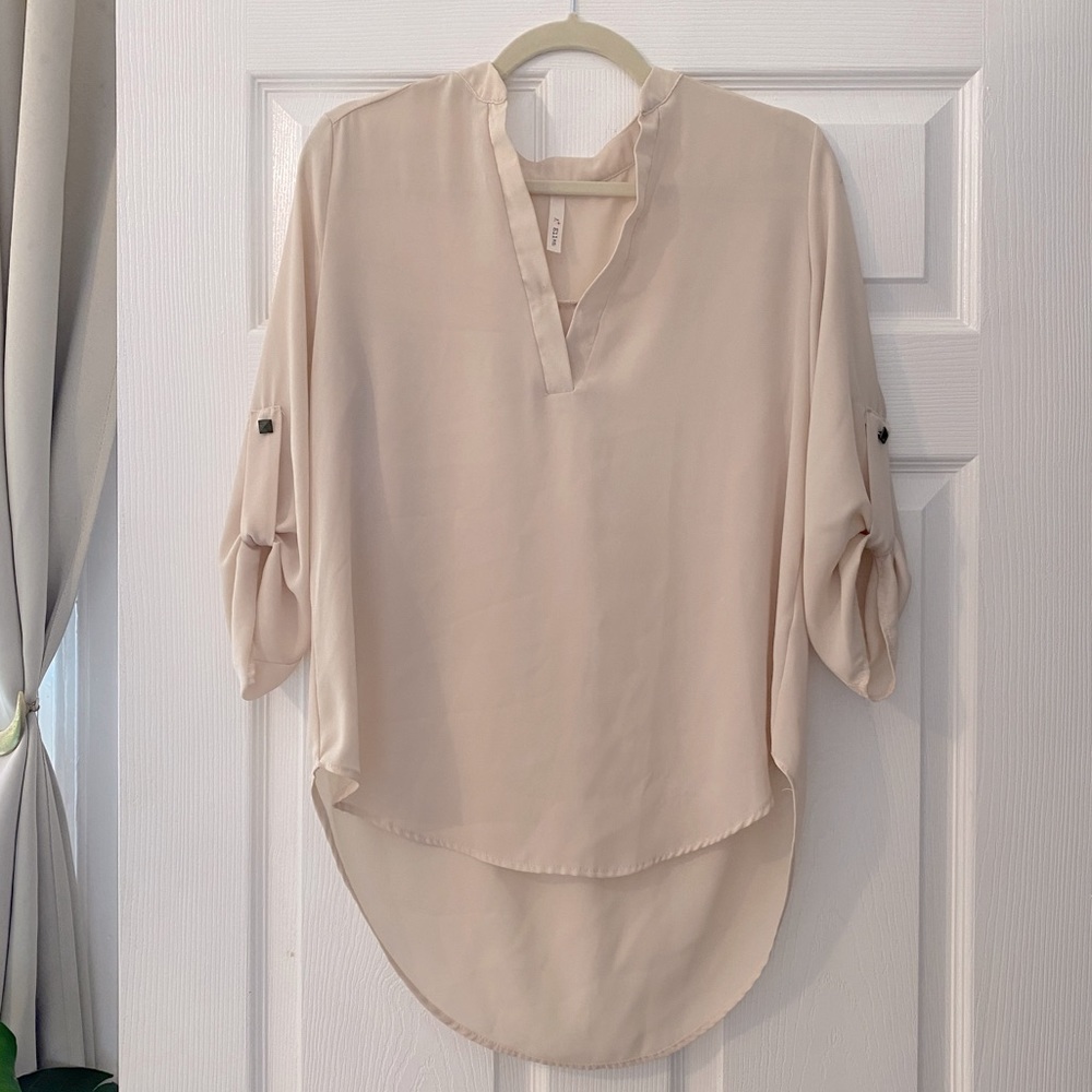 Cream flowy long sleeve blouse from A+ Ellen with pinned sleeves